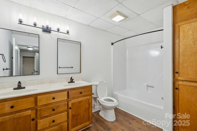 3090 Goblet Rd, Richburg, SC 29729 - full bath with toilet, double vanity, a paneled ceiling, wood finished floors, and shower / bath combination
