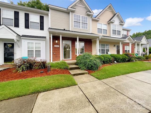 14123 Tranters Creek Ln, Charlotte, NC 28273 - view of front of house featuring brick siding and a front yard