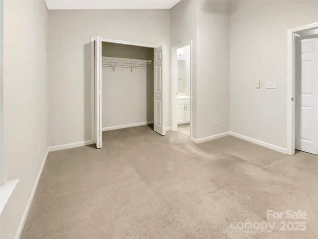 14123 Tranters Creek Ln, Charlotte, NC 28273 - unfurnished bedroom featuring carpet, baseboards, connected bathroom, and a closet