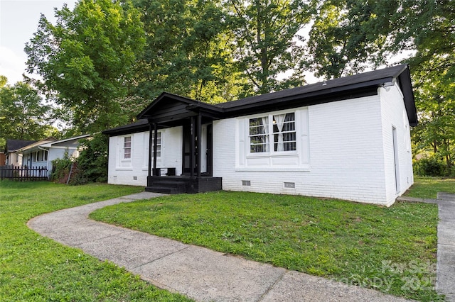 901 Echo Glen Rd, Charlotte, NC 28213 - view of front facade with crawl space, a front yard, and brick siding