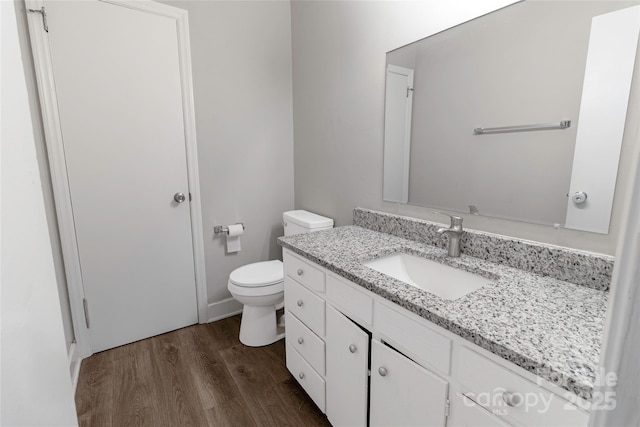 901 Echo Glen Rd, Charlotte, NC 28213 - bathroom featuring wood finished floors, vanity, and toilet