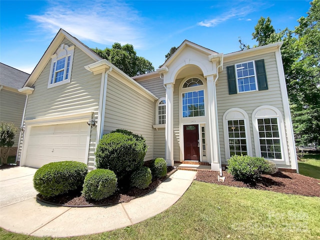 6413 Fillian Ln, Charlotte, NC 28269 - view of front of house with a garage, driveway, and a front yard