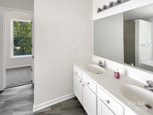 6413 Fillian Ln, Charlotte, NC 28269 - full bath with double vanity and baseboards