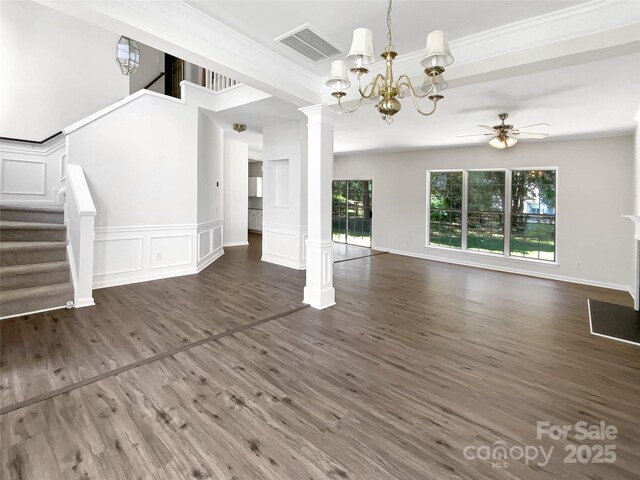 6413 Fillian Ln, Charlotte, NC 28269 - unfurnished living room featuring stairway, decorative columns, a ceiling fan, a chandelier, and wood finished floors