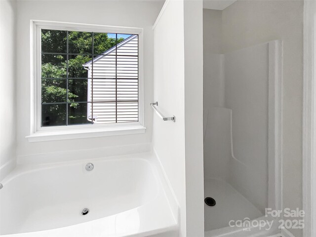 6413 Fillian Ln, Charlotte, NC 28269 - full bathroom featuring a bath and a shower