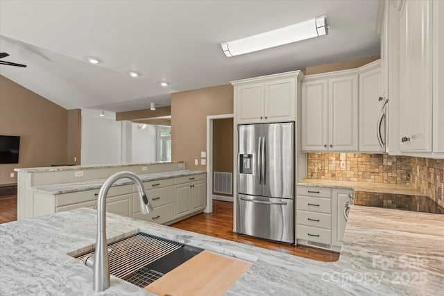 1819 Brompton Ct, Newton, NC 28658 - kitchen featuring stainless steel appliances, wood finished floors, white cabinetry, lofted ceiling, and recessed lighting