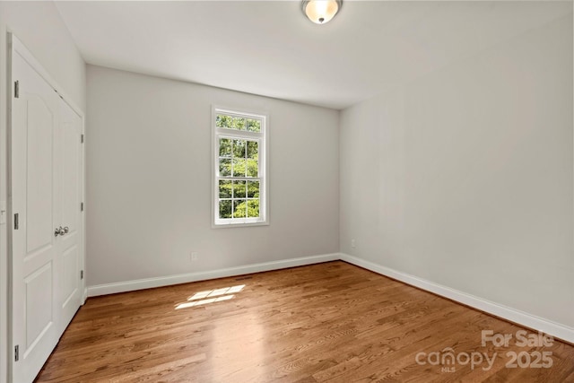 1819 Brompton Ct, Newton, NC 28658 - unfurnished bedroom featuring wood finished floors and a closet