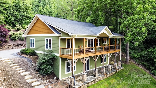 171 View Ridge Parkway, Leicester, NC 28748 - back of property with a shingled roof and a patio