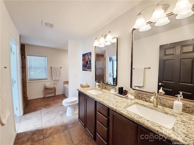171 View Ridge Parkway, Leicester, NC 28748 - full bathroom featuring double vanity, a chandelier, toilet, and a bath
