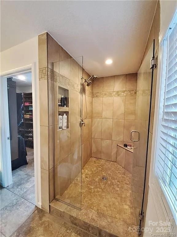 171 View Ridge Parkway, Leicester, NC 28748 - bathroom with a shower stall and a spacious closet