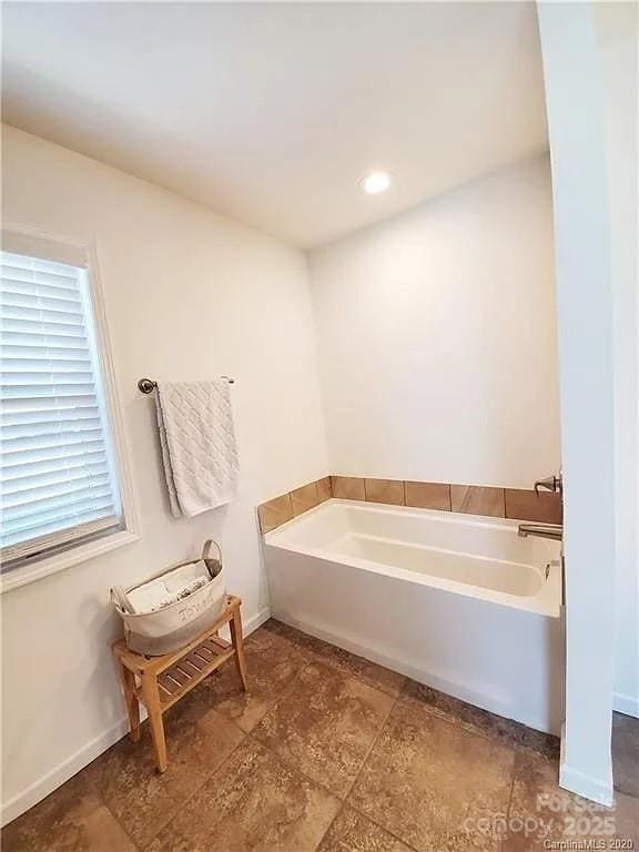 171 View Ridge Parkway, Leicester, NC 28748 - bathroom featuring a garden tub and baseboards