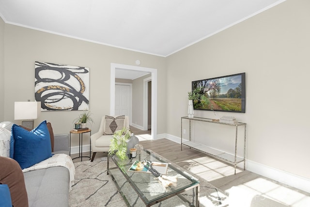 210 E 5th Ave, Gastonia, NC 28054 - living area featuring wood finished floors, ornamental molding, and baseboards