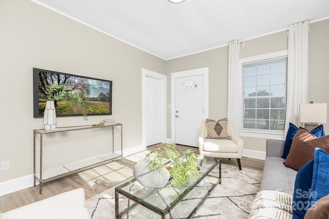 210 E 5th Ave, Gastonia, NC 28054 - living area featuring crown molding, wood finished floors, and baseboards