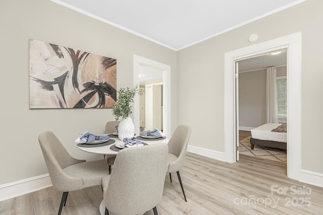 210 E 5th Ave, Gastonia, NC 28054 - dining room with wood finished floors, crown molding, and baseboards