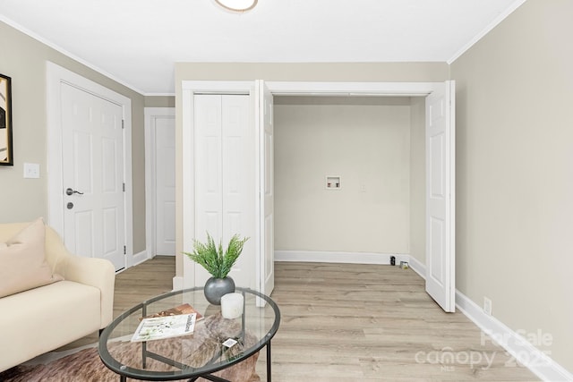 210 E 5th Ave, Gastonia, NC 28054 - living area featuring light wood-style floors, ornamental molding, and baseboards