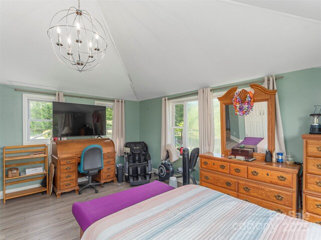 78 Hardin Ln, Clyde, NC 28721 - bedroom featuring vaulted ceiling, wood finished floors, a chandelier, and a desk