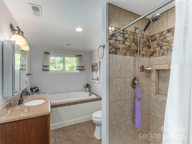 78 Hardin Ln, Clyde, NC 28721 - bathroom featuring a bath, toilet, vanity, a tile shower, and recessed lighting
