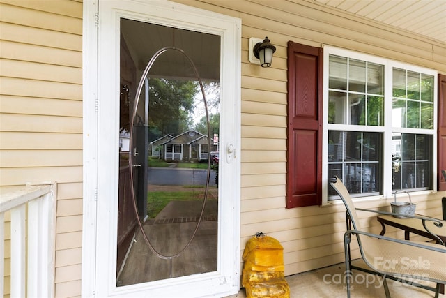 122 Pratt St, Belmont, NC 28012 - doorway to property featuring a porch and a water view