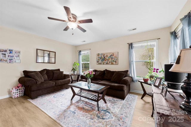 122 Pratt St, Belmont, NC 28012 - living room featuring light wood-style flooring, a ceiling fan, and baseboards
