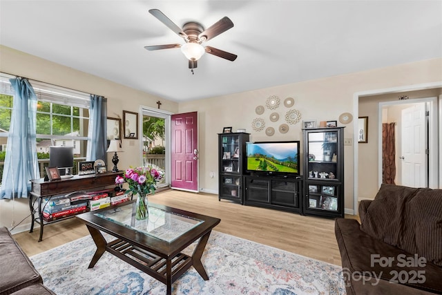 122 Pratt St, Belmont, NC 28012 - living room featuring ceiling fan, wood finished floors, and baseboards