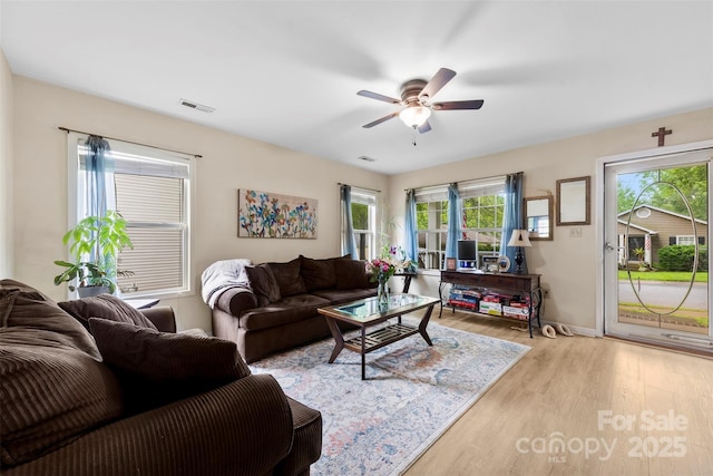 122 Pratt St, Belmont, NC 28012 - living area featuring ceiling fan, wood finished floors, and baseboards