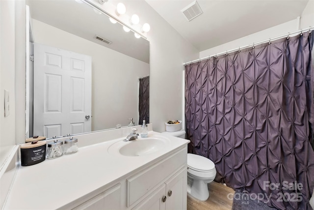 122 Pratt St, Belmont, NC 28012 - bathroom with vanity, toilet, wood finished floors, and curtained shower