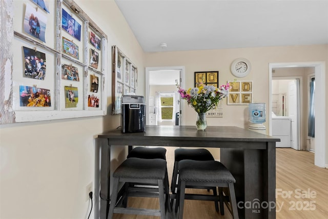 122 Pratt St, Belmont, NC 28012 - dining space with washer / dryer and wood finished floors