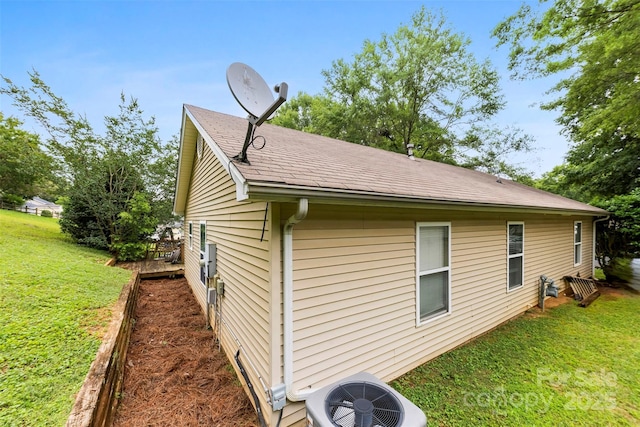 122 Pratt St, Belmont, NC 28012 - view of side of home with central AC, a lawn, and roof with shingles