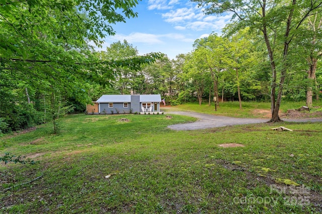 28 Reynolds School Rd, Asheville, NC 28803 - view of grassy yard featuring a forest view