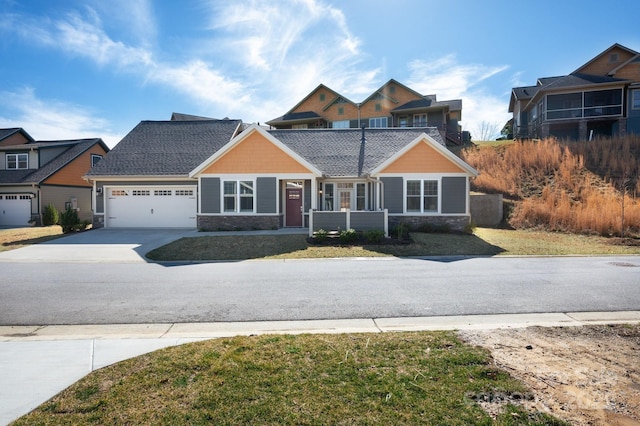 76 Creekside View Dr, Asheville, NC 28804 - craftsman-style home featuring stone siding, concrete driveway, and an attached garage