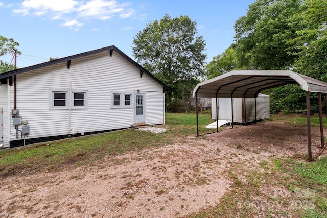 1406 Upper Enochville Rd, Kannapolis, NC 28081 - view of property exterior featuring a detached carport and dirt driveway