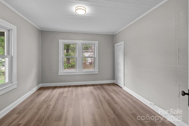 1406 Upper Enochville Rd, Kannapolis, NC 28081 - unfurnished room featuring plenty of natural light, wood finished floors, crown molding, and baseboards