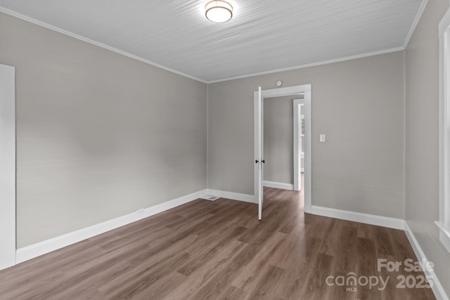 1406 Upper Enochville Rd, Kannapolis, NC 28081 - empty room featuring wood finished floors, baseboards, and ornamental molding