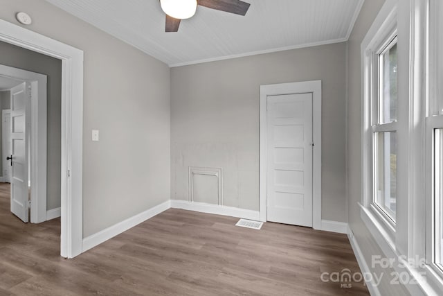 1406 Upper Enochville Rd, Kannapolis, NC 28081 - unfurnished room featuring a ceiling fan, wood finished floors, baseboards, crown molding, and a smoke detector