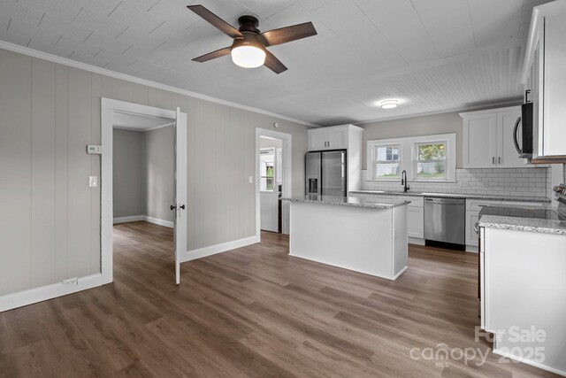 1406 Upper Enochville Rd, Kannapolis, NC 28081 - kitchen featuring stainless steel appliances, healthy amount of natural light, crown molding, a center island, and baseboards