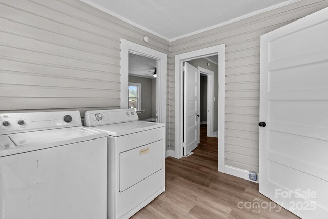 1406 Upper Enochville Rd, Kannapolis, NC 28081 - laundry room featuring independent washer and dryer, crown molding, light wood finished floors, and wooden walls