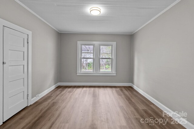 1406 Upper Enochville Rd, Kannapolis, NC 28081 - empty room with wood finished floors, baseboards, and crown molding