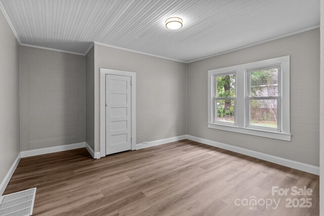 1406 Upper Enochville Rd, Kannapolis, NC 28081 - empty room with wood finished floors, ornamental molding, and baseboards