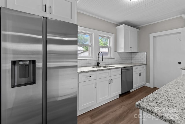 1406 Upper Enochville Rd, Kannapolis, NC 28081 - kitchen with appliances with stainless steel finishes, a sink, white cabinets, dark wood-style flooring, and decorative backsplash