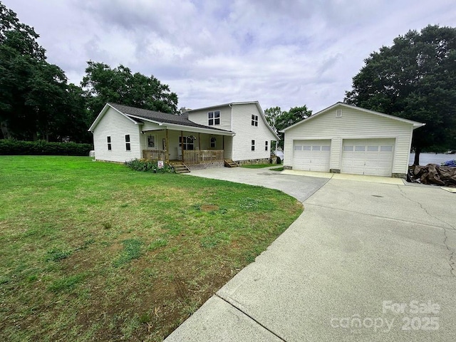 4574 Ivy Run Ln, Denver, NC 28037 - view of front of home featuring covered porch, an outbuilding, a front lawn, and a detached garage