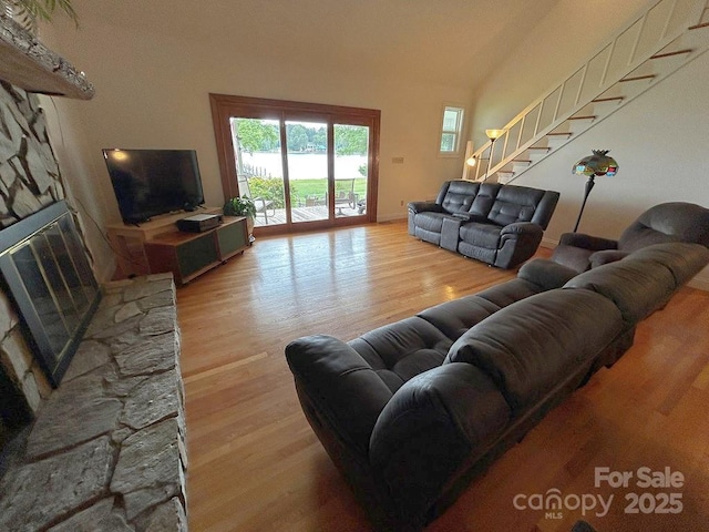 4574 Ivy Run Ln, Denver, NC 28037 - living room with wood finished floors, stairway, and a fireplace