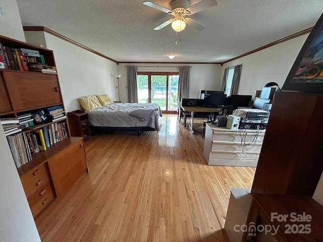 4574 Ivy Run Ln, Denver, NC 28037 - bedroom with ornamental molding, wood finished floors, a textured ceiling, access to outside, and a desk