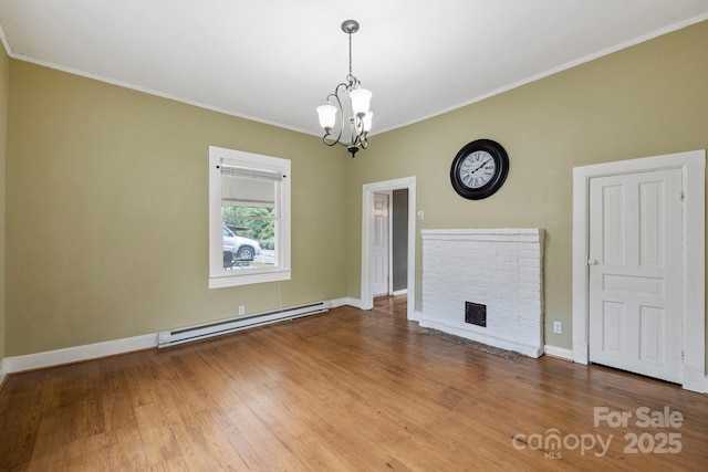 61 First St, Marion, NC 28752 - unfurnished living room featuring a baseboard radiator, a chandelier, wood finished floors, baseboards, and ornamental molding