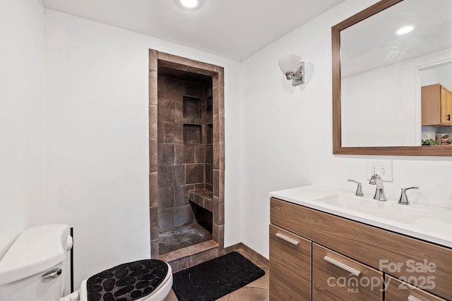 61 First St, Marion, NC 28752 - bathroom featuring toilet, tiled shower, vanity, and recessed lighting