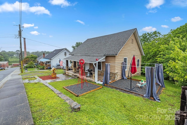 61 First St, Marion, NC 28752 - view of front of property with a front yard and a shingled roof