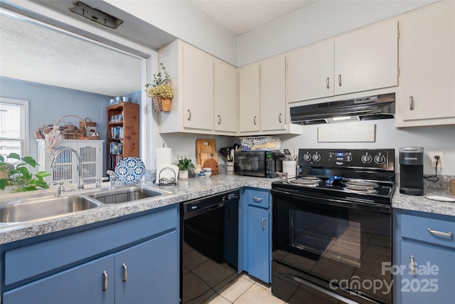 16 Fieldstone Ct, Arden, NC 28704 - kitchen with black appliances, under cabinet range hood, blue cabinetry, light countertops, and a textured ceiling