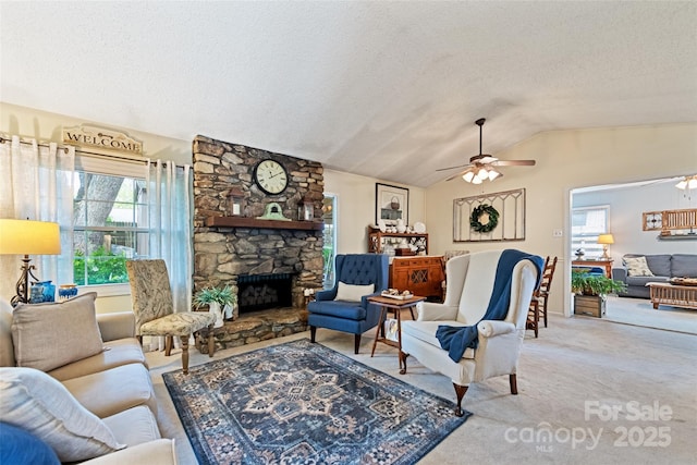 16 Fieldstone Ct, Arden, NC 28704 - living room featuring a textured ceiling, a ceiling fan, vaulted ceiling, carpet, and a stone fireplace