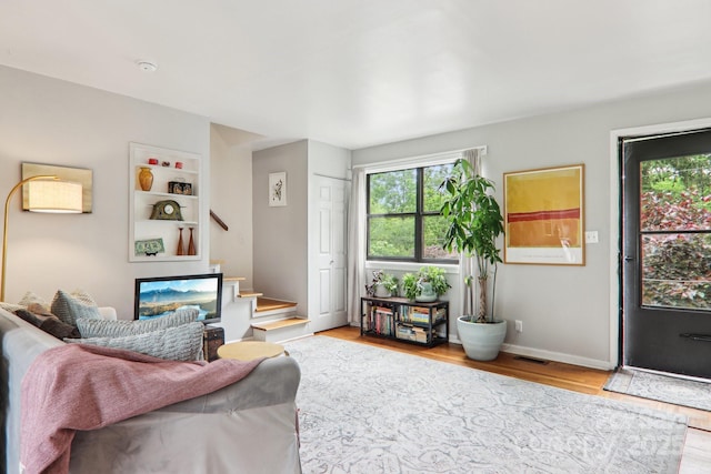 615 Biltmore Ave Unit K2, Asheville, NC 28803 - living area featuring healthy amount of natural light, stairway, and wood finished floors