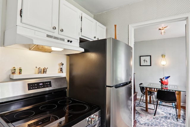 615 Biltmore Ave Unit K2, Asheville, NC 28803 - kitchen with stainless steel appliances, wallpapered walls, under cabinet range hood, and white cabinetry