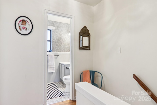 615 Biltmore Ave Unit K2, Asheville, NC 28803 - bathroom with toilet, wainscoting, and wood finished floors